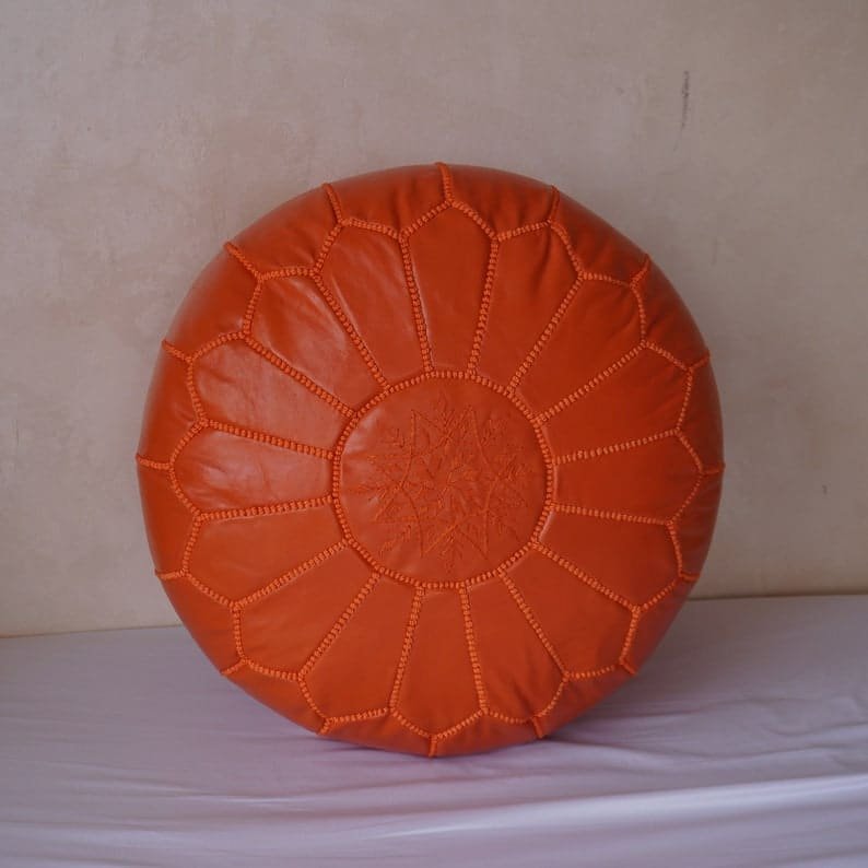 Orange Moroccan Leather Pouf handcrafted from high-quality leather, adding vibrant style to any home décor.