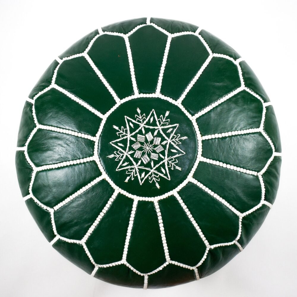 Handmade green leather pouf with sleek design, perfect for modern living room decor.