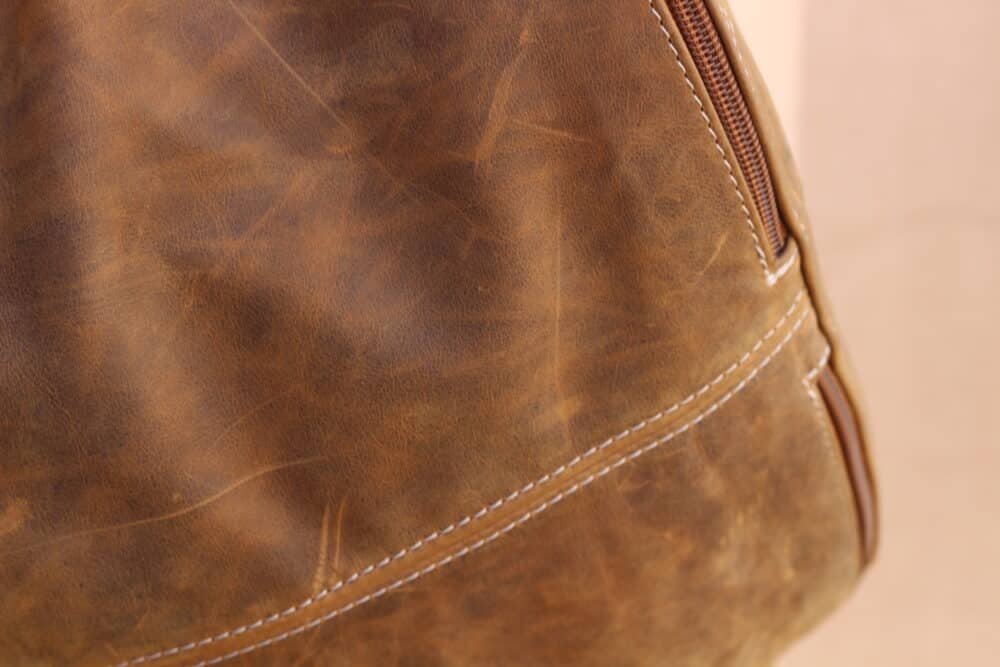 Close-up of premium full-grain leather material used in the sling bag.