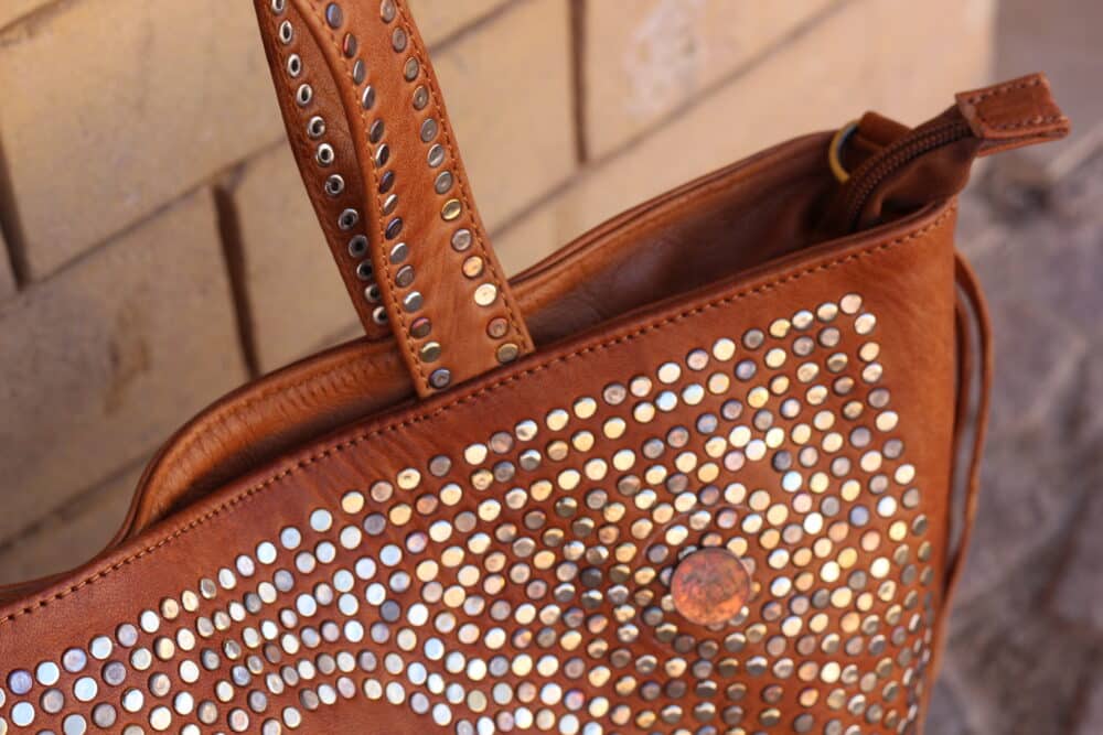 Compact leather cross the body bag with spacious interior compartments