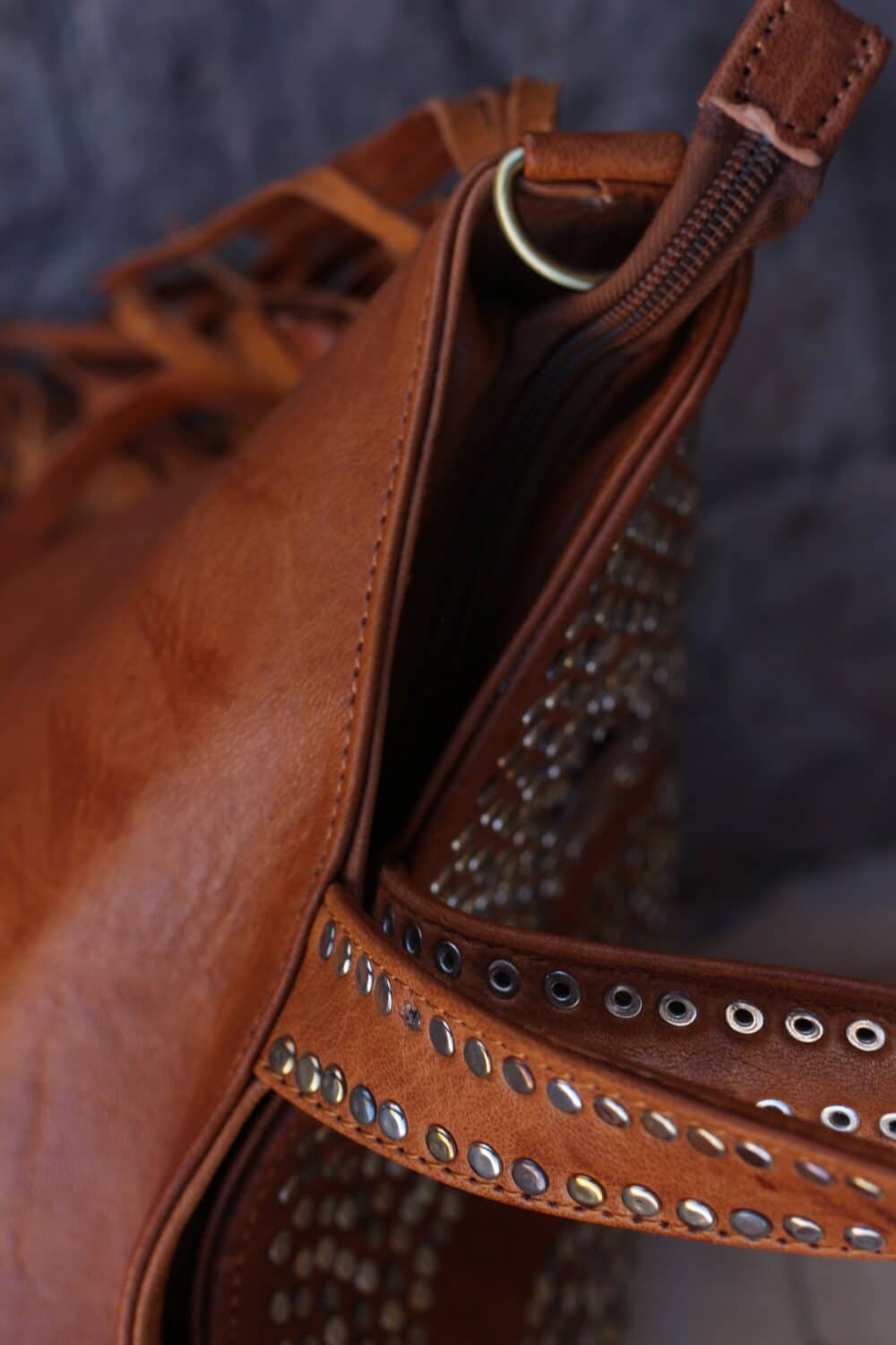 Modern leather cross the body bag in tan with a slim profile design