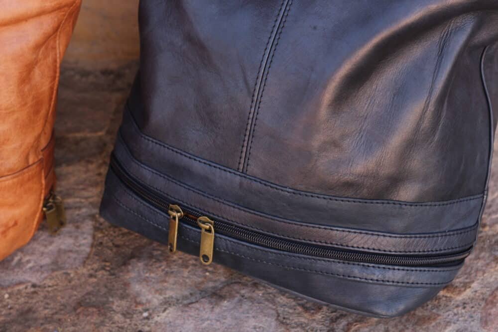 Interior of Leather Messenger Bag showing laptop compartment and organized space.