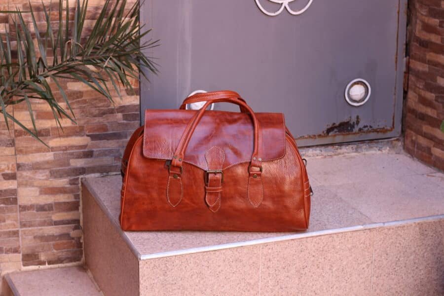 amazing Large leather travel bag with adjustable strap and sleek design.