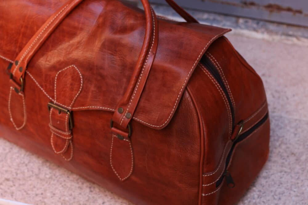 Side view of the amazing large leather travel bag showing spacious compartments.