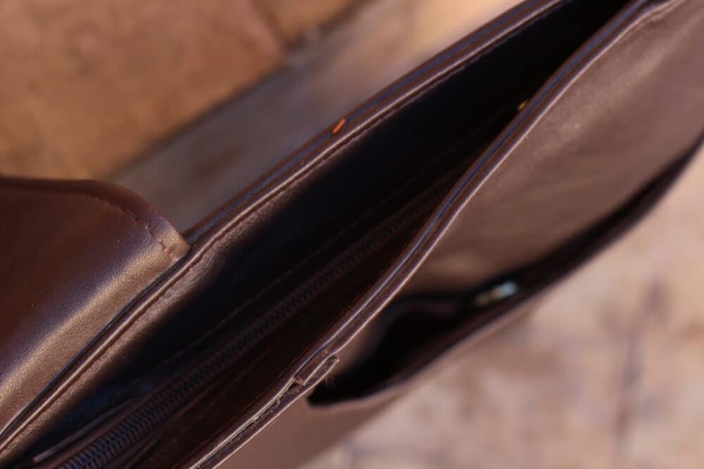 Spacious interior of brown leather tote bag