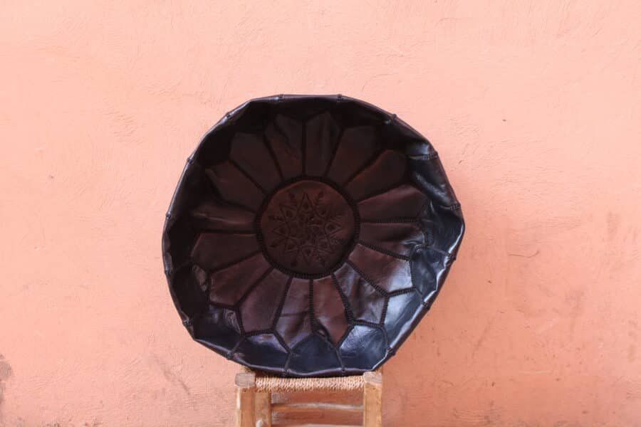 Black Moroccan Leather Pouf handcrafted with premium leather, ideal for sophisticated home décor.