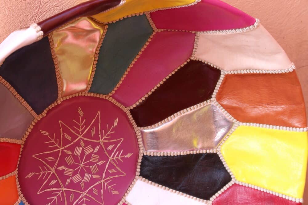 Multicolor Moroccan Leather Pouf handcrafted with vibrant patchwork design for home decor.