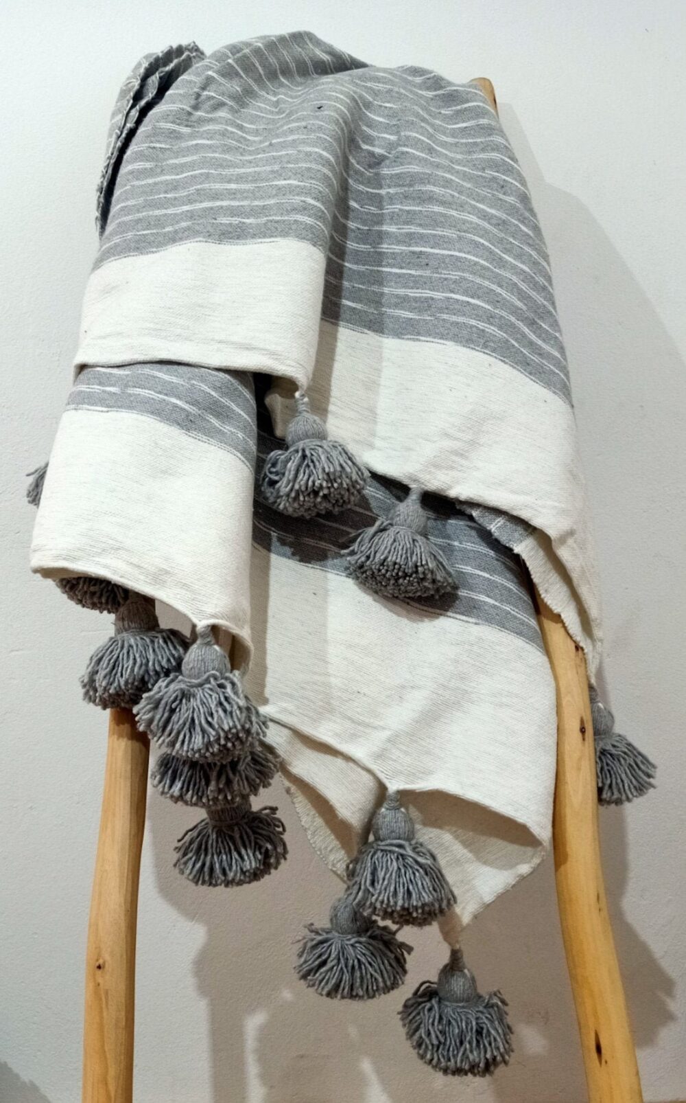 Handwoven bed blanket with intricate design, perfect for comfort and warmth.