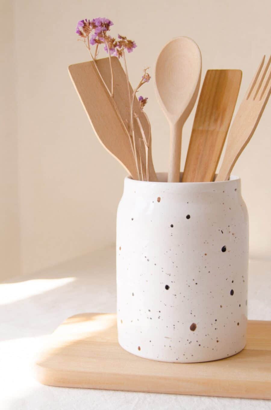 Rustic ceramic utensil holder close-up