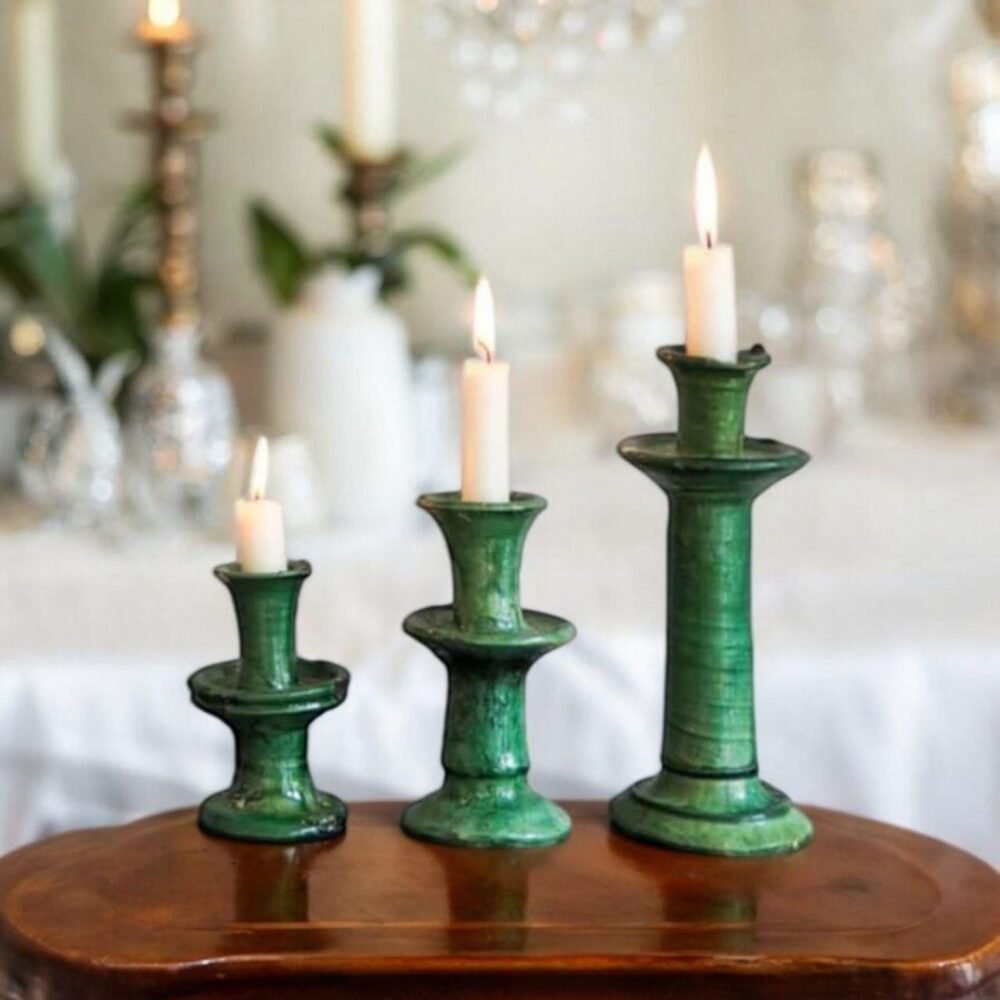 Handmade ceramic candlestick holder on a wooden table