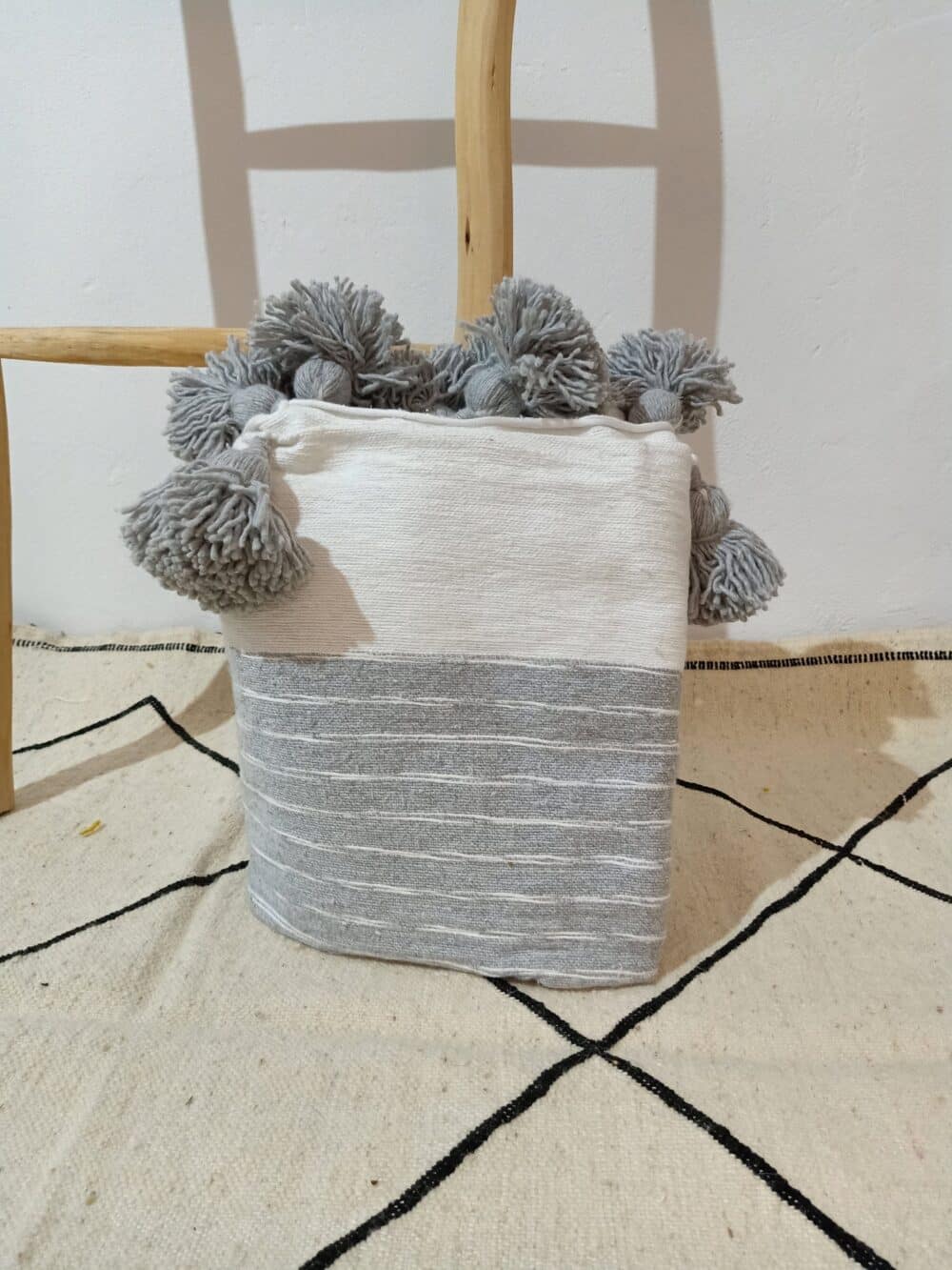 Handwoven bed blanket with intricate design, perfect for comfort and warmth.