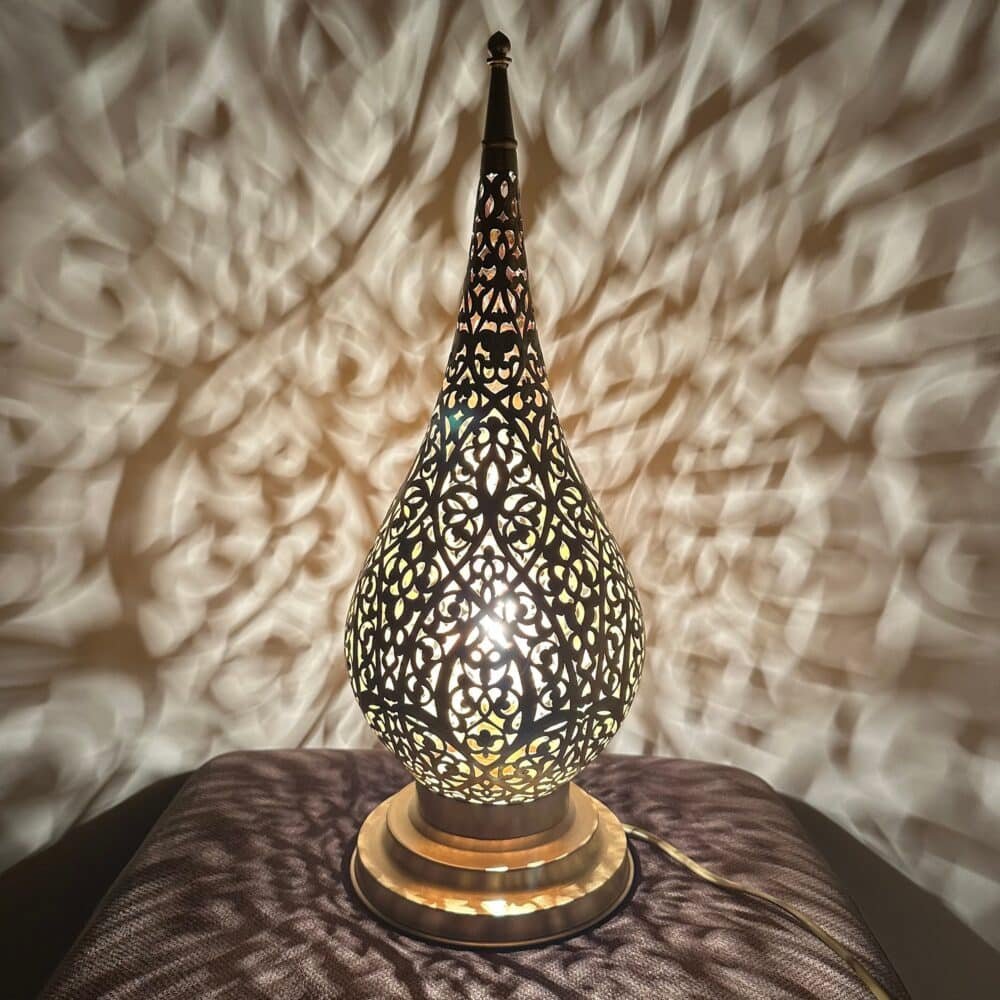 Beautiful gold table lamp with a sleek and modern design.