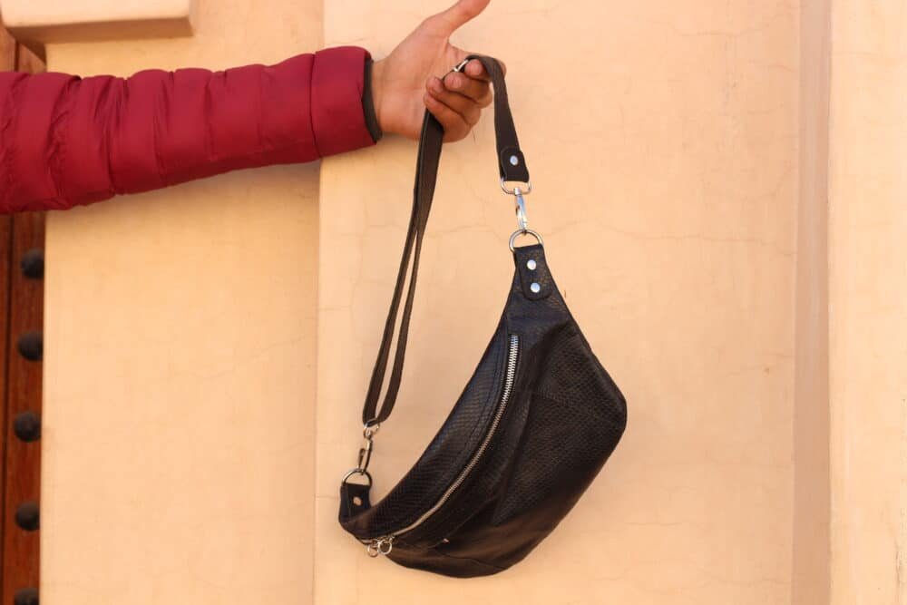 Leather belt bag styled with a casual outfit for modern convenience.