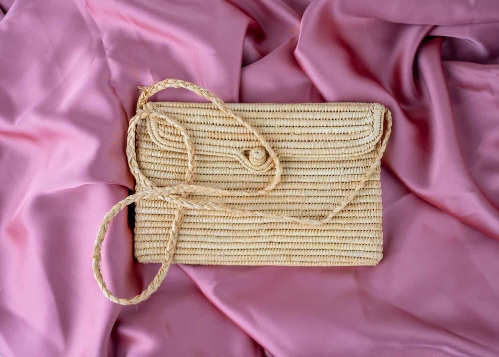 Special Handmade Raffia Cross Body Bag with intricate raffia weaving and an adjustable strap